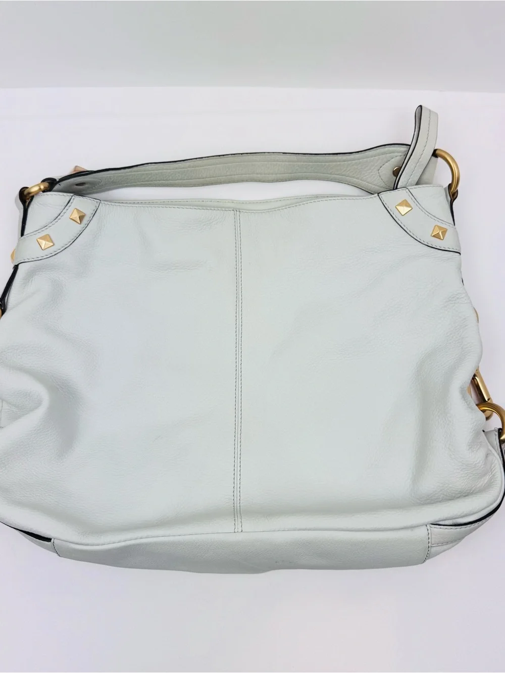 B. Makowsky Leather Ivory Hobo handbag. Gold-tone stud accent hardware.